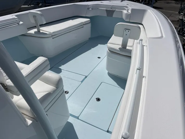  Yacht Photos Pics 2025 Contender 30 ST boat interior with white seating and spacious deck layout.