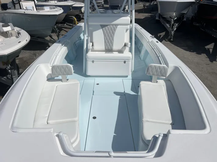  Yacht Photos Pics 2025 Contender 30 ST boat interior with white seating and center console.