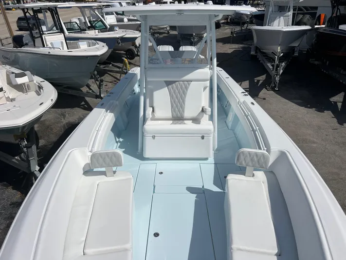  Yacht Photos Pics 2025 Contender 30 ST boat interior with white seating and center console.