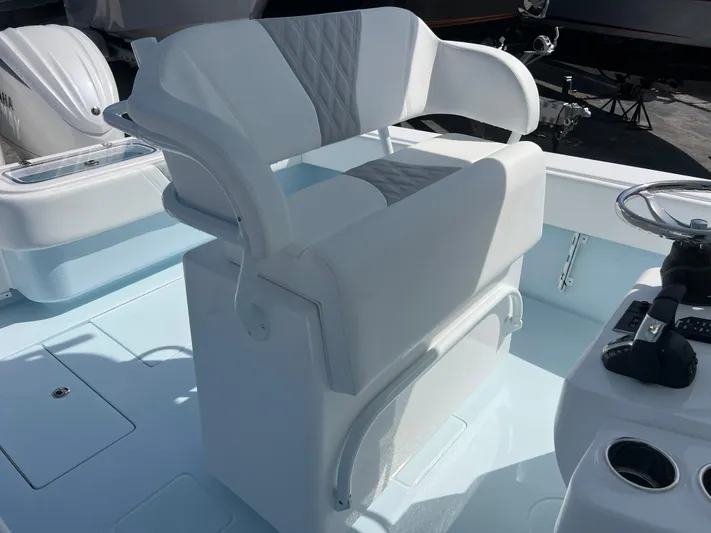  Yacht Photos Pics 2025 Contender 30 ST boat seat with white and gray upholstery, featuring a sleek design.