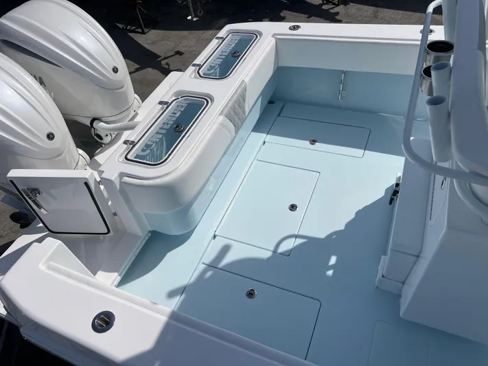  Yacht Photos Pics 2025 Contender 30 ST boat deck with dual engines and storage compartments.