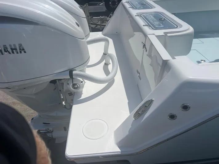  Yacht Photos Pics 2025 Contender 30 ST boat with Yamaha outboard engines, featuring a sleek white deck design.
