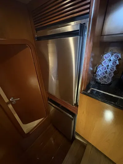 Prelude Yacht Photos Pics Stainless steel refrigerator in 2004 Sunseeker Manhattan 56 yacht kitchen.