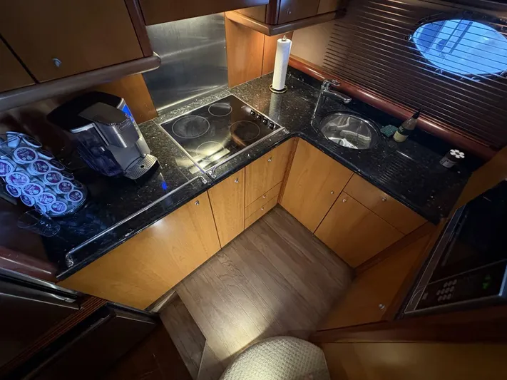 Prelude Yacht Photos Pics Luxurious 2004 Sunseeker Manhattan 56 yacht kitchen with modern appliances and sleek design.
