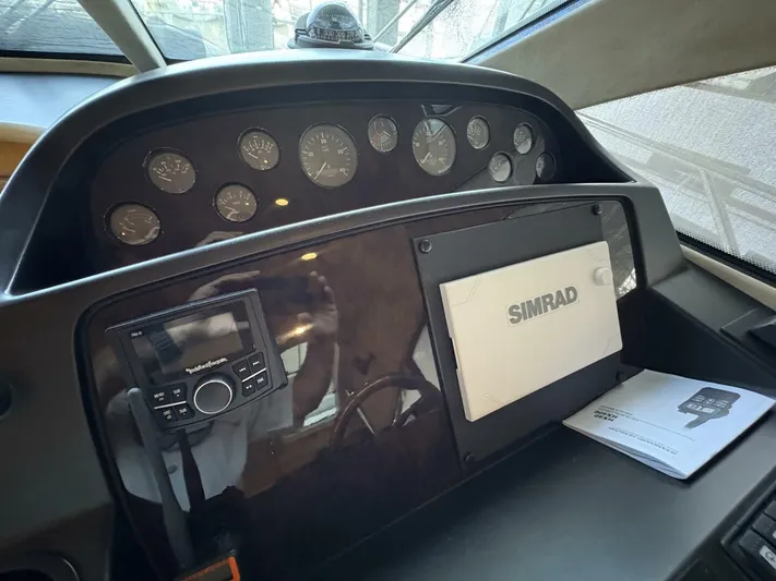 Prelude Yacht Photos Pics Control panel of a 2004 Sunseeker Manhattan 56 yacht with Simrad navigation system.