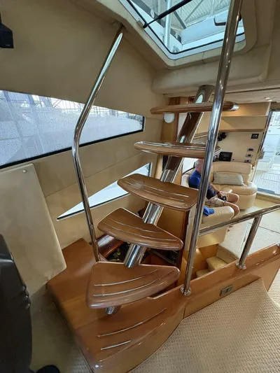 Prelude Yacht Photos Pics Interior of 2004 Sunseeker Manhattan 56 yacht with modern spiral staircase.