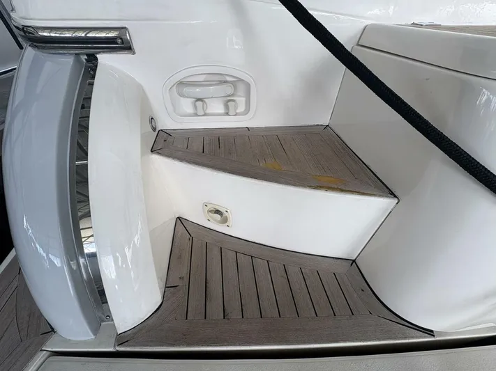 Prelude Yacht Photos Pics Steps on a 2004 Sunseeker Manhattan 56 yacht with wooden finish and sleek design.