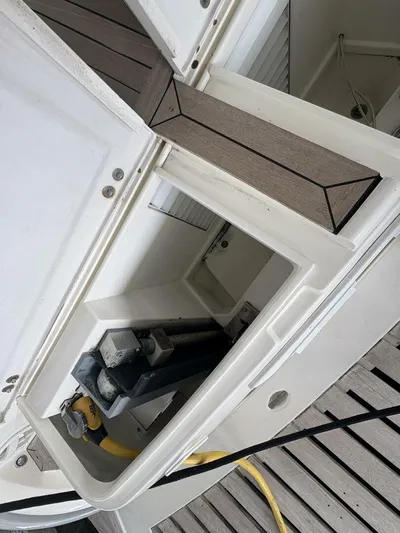 Prelude Yacht Photos Pics 2004 Sunseeker Manhattan 56 yacht deck with storage compartment and power cables.