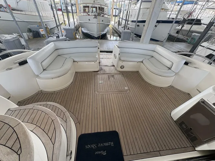 Prelude Yacht Photos Pics Luxurious 2004 Sunseeker Manhattan 56 yacht with spacious deck and elegant seating.