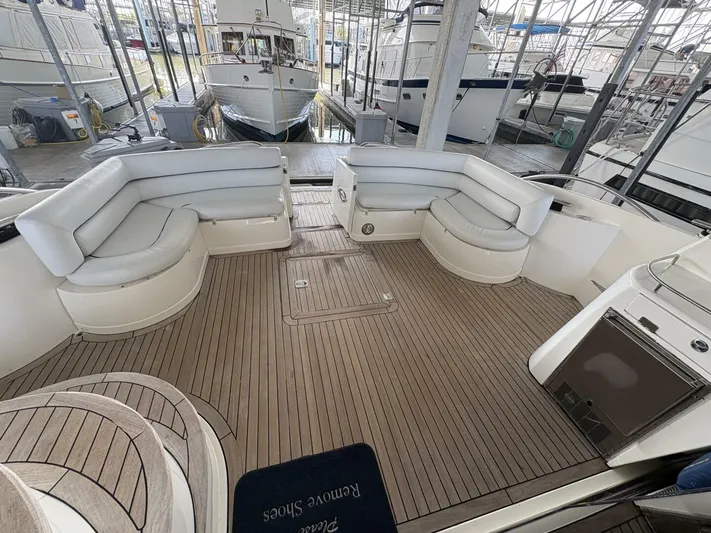 Prelude Yacht Photos Pics Luxurious 2004 Sunseeker Manhattan 56 yacht interior with elegant seating and teak flooring.