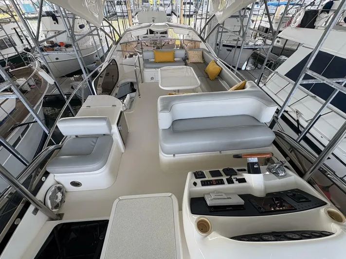 Prelude Yacht Photos Pics Luxurious 2004 Sunseeker Manhattan 56 yacht interior with elegant seating and control panel.