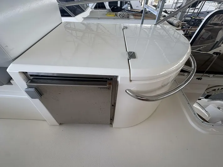 Prelude Yacht Photos Pics Sunseeker Manhattan 56 yacht interior detail, featuring a compact kitchenette with stainless steel accents.