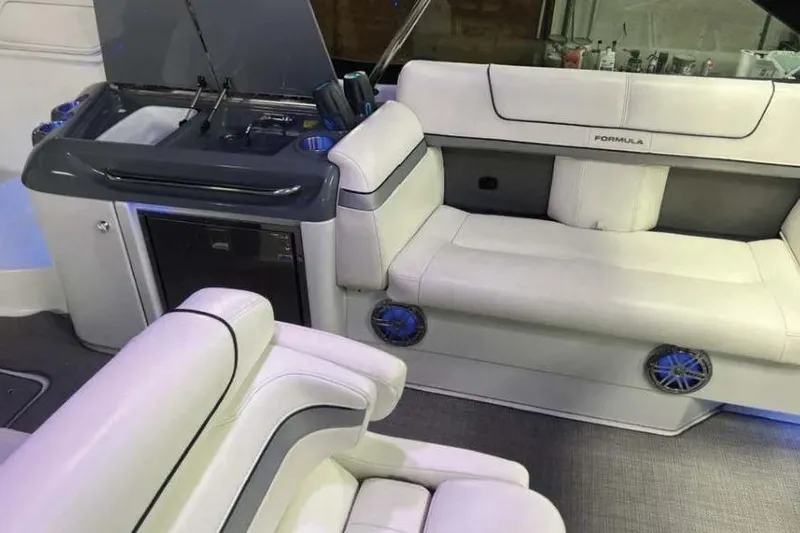  Yacht Photos Pics 2015 Formula 350 Crossover Bowrider interior with white seating and kitchenette.