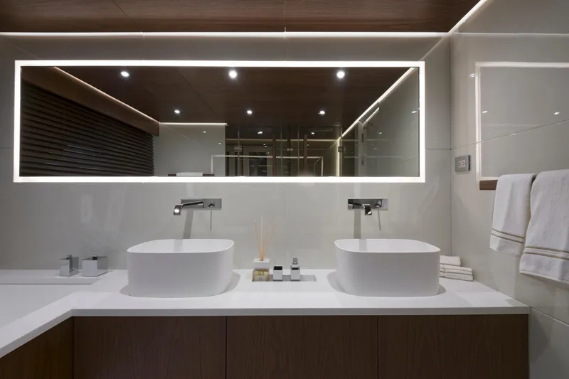 Utopia IV Yacht Photos Pics Luxurious modern bathroom on 2018 Rossinavi Custom yacht with dual sinks and illuminated mirror.