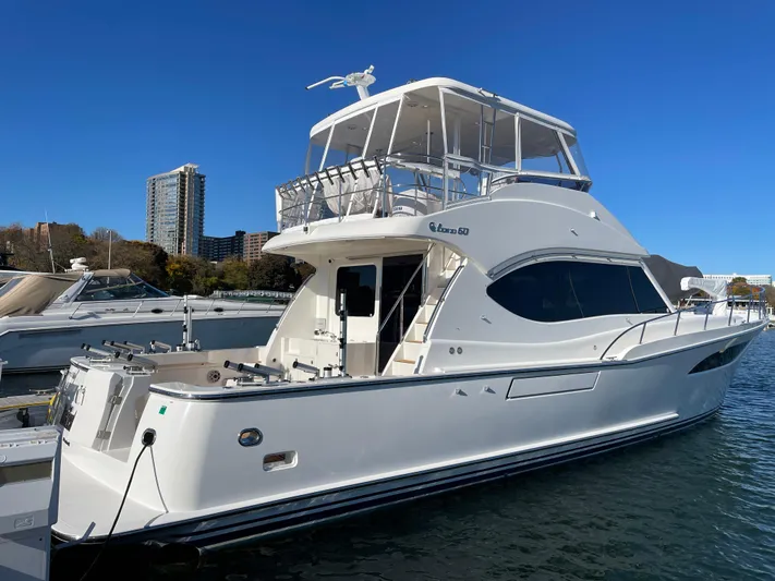 Resiliensea Yacht Photos Pics 2014 Nordhavn 60 Toro Convertible yacht docked in marina, clear blue sky.