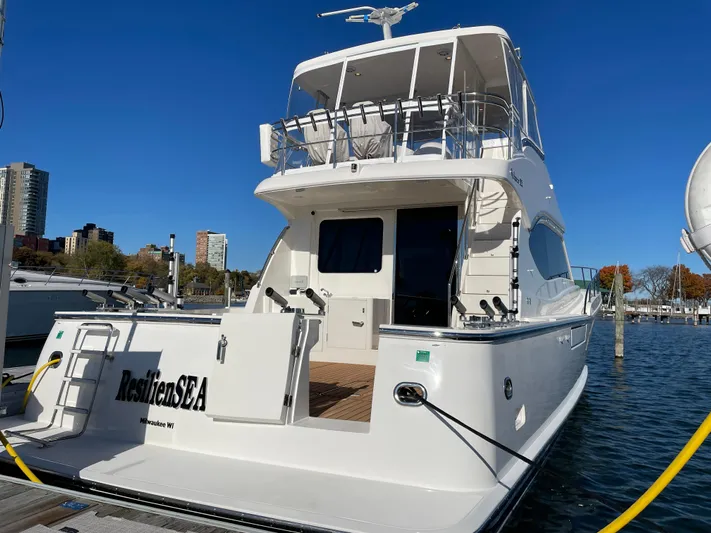 Resiliensea Yacht Photos Pics 2014 Nordhavn 60 Toro Convertible yacht docked at marina, clear blue sky.