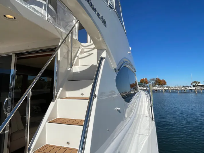 Resiliensea Yacht Photos Pics 2014 Nordhavn 60 Toro Convertible yacht with sleek design, docked by calm waters.