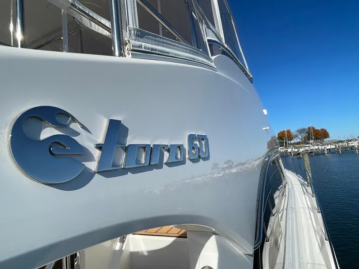 Resiliensea Yacht Photos Pics 2014 Nordhavn 60 Toro Convertible yacht docked under clear blue sky.