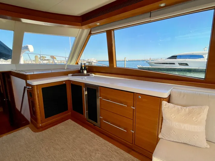 Resiliensea Yacht Photos Pics Luxurious interior of 2014 Nordhavn 60 Toro Convertible yacht with ocean view.