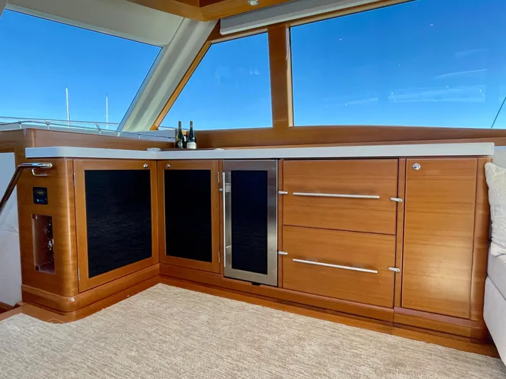 Resiliensea Yacht Photos Pics Luxurious interior of 2014 Nordhavn 60 Toro Convertible yacht with wooden cabinetry.