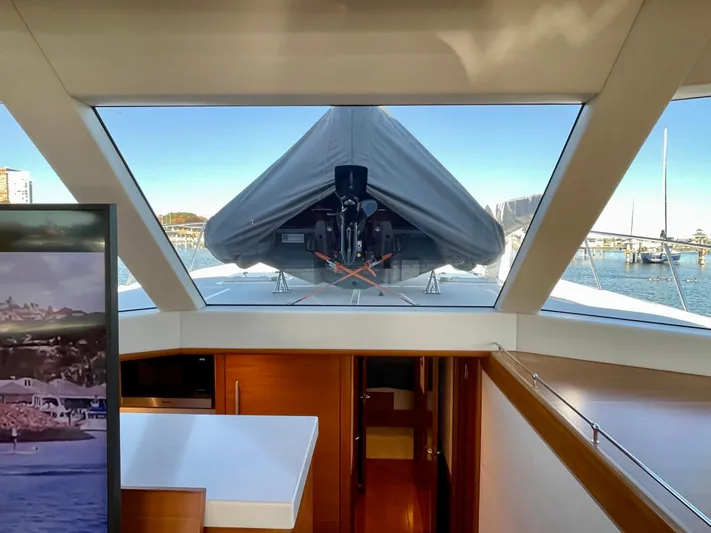 Resiliensea Yacht Photos Pics Interior view of 2014 Nordhavn 60 Toro Convertible yacht with large windows and sleek design.