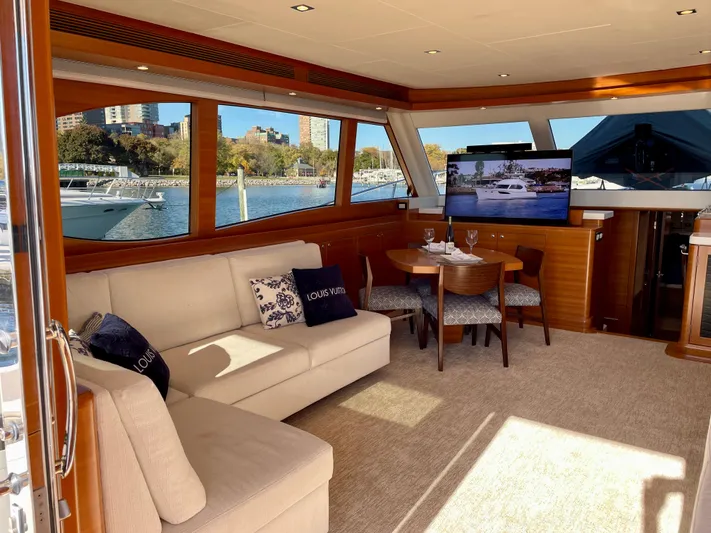 Resiliensea Yacht Photos Pics Luxurious interior of 2014 Nordhavn 60 Toro Convertible yacht with scenic marina view.