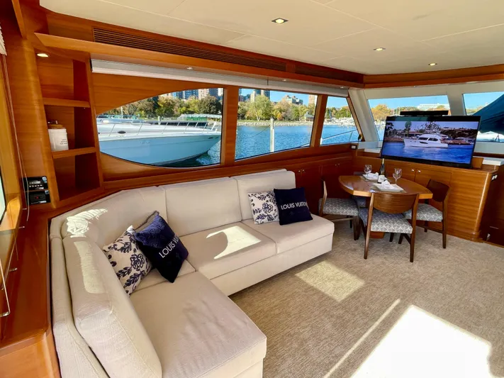 Resiliensea Yacht Photos Pics Luxurious interior of 2014 Nordhavn 60 Toro Convertible yacht with elegant seating and dining area.