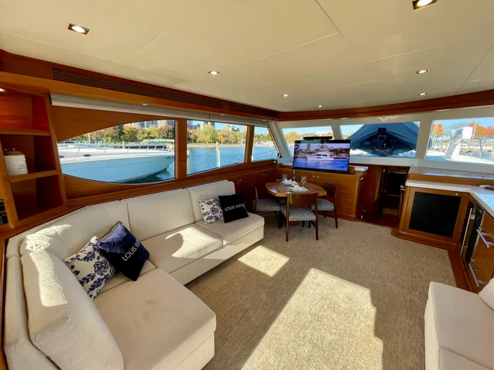 Resiliensea Yacht Photos Pics Luxurious interior of 2014 Nordhavn 60 Toro Convertible yacht with plush seating and scenic windows.