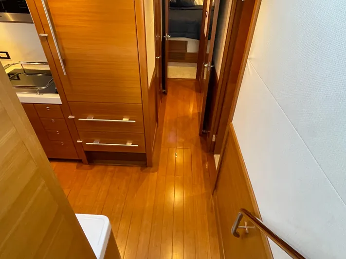 Resiliensea Yacht Photos Pics Interior view of 2014 Nordhavn 60 Toro Convertible yacht with wooden flooring and cabinetry.