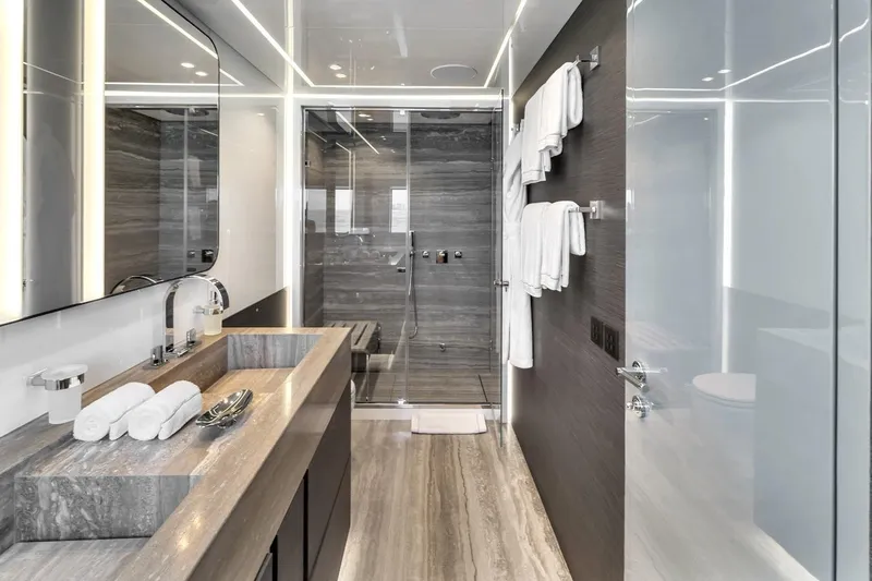 Nana I Yacht Photos Pics Luxurious bathroom on 2020 Mangusta 110 Open yacht with modern design and elegant fixtures.