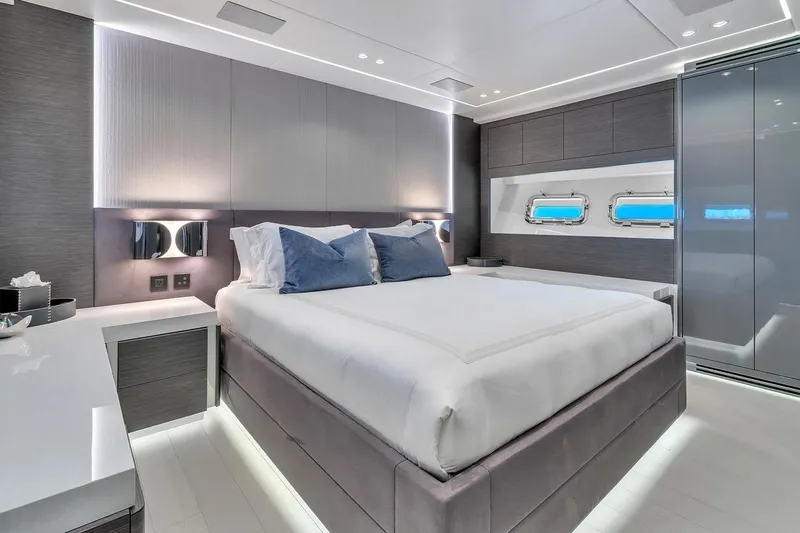Nana I Yacht Photos Pics Luxurious bedroom interior of 2020 Mangusta 110 Open yacht with modern design and elegant lighting.