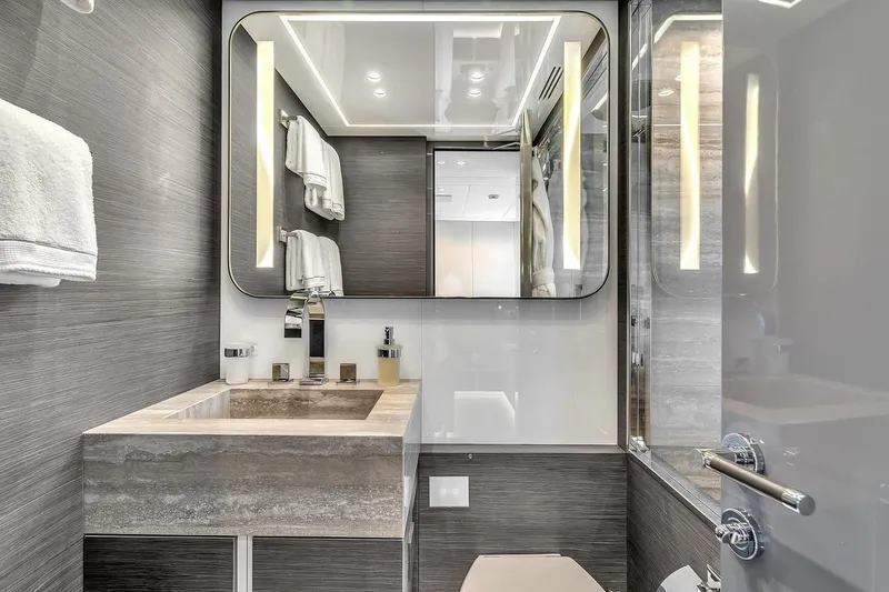 Nana I Yacht Photos Pics Luxurious bathroom interior of 2020 Mangusta 110 Open yacht, featuring modern design and elegant fixtures.