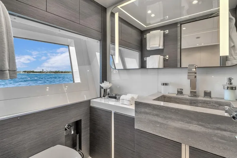 Nana I Yacht Photos Pics Luxurious bathroom interior on 2020 Mangusta 110 Open yacht with ocean view.