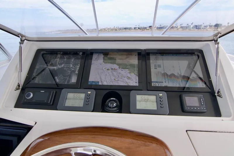 Serenity Now Yacht Photos Pics Viking 66 Convertible 2014 yacht dashboard with navigation screens and controls.