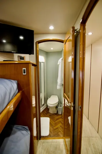 Serenity Now Yacht Photos Pics Interior of 2014 Viking 66 Convertible yacht with bathroom and bunk beds.