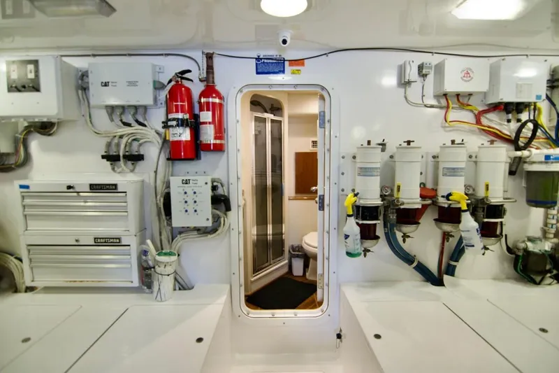 Serenity Now Yacht Photos Pics Engine room of 2014 Viking 66 Convertible yacht with equipment and safety features.