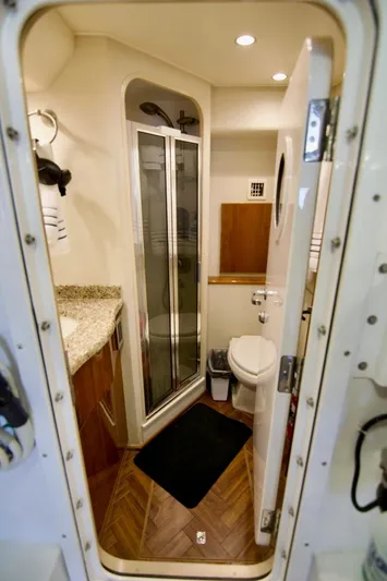 Serenity Now Yacht Photos Pics Luxurious bathroom in 2014 Viking 66 Convertible yacht with modern amenities and elegant design.