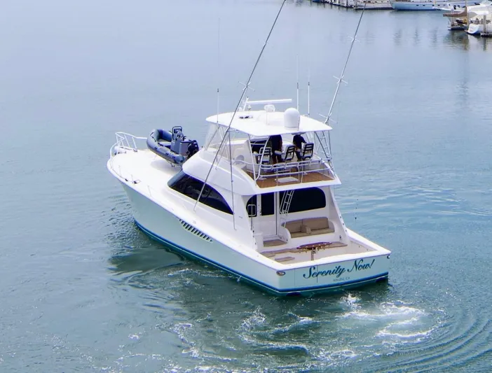 Serenity Now Yacht Photos Pics 2014 Viking 66 Convertible yacht cruising in a marina.