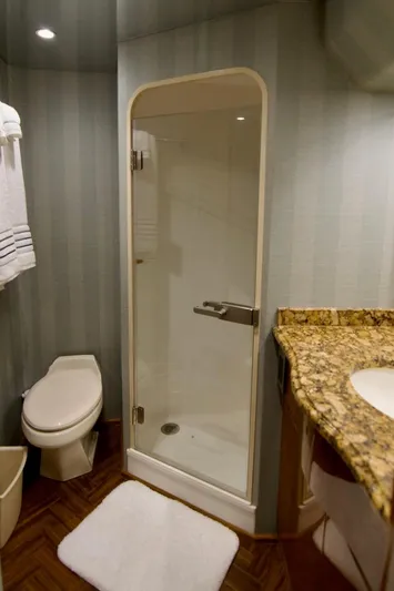Serenity Now Yacht Photos Pics Luxurious bathroom in 2014 Viking 66 Convertible yacht with shower and granite countertop.