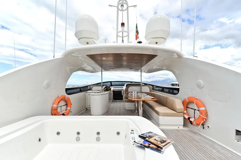  Yacht Photos Pics Luxurious 2009 Maiora 32 yacht deck with seating, jacuzzi, and life rings.