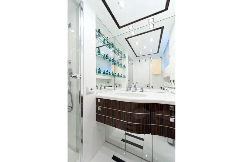  Yacht Photos Pics Luxurious bathroom in 2009 Maiora 32 yacht with modern fixtures and mirrored walls.