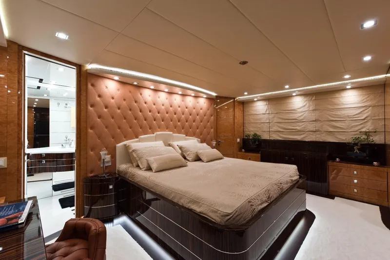  Yacht Photos Pics Luxurious bedroom interior on 2009 Maiora 32 yacht, featuring elegant design and plush furnishings.