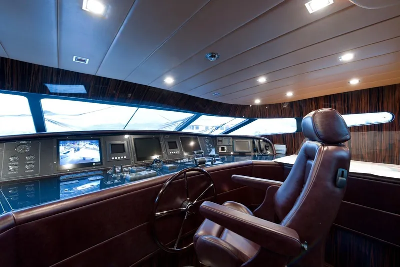  Yacht Photos Pics Luxurious 2009 Maiora 32 yacht cockpit with advanced navigation systems and leather seating.