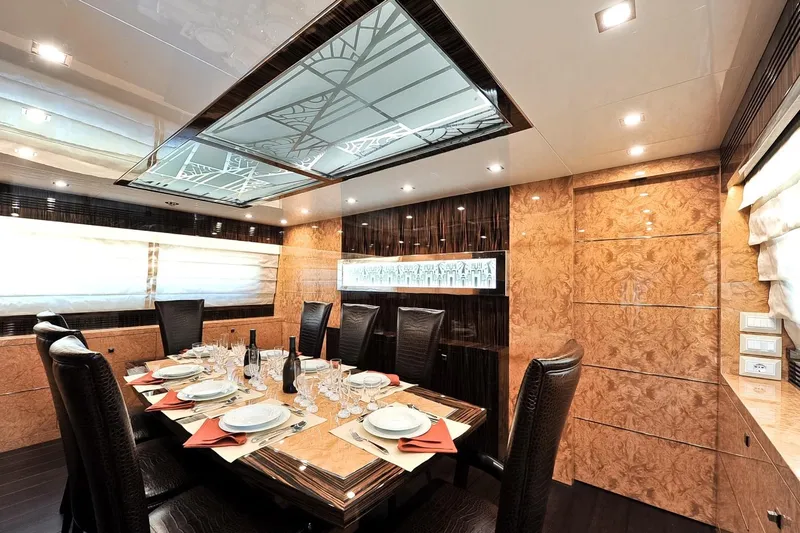  Yacht Photos Pics Luxurious dining area on 2009 Maiora 32 yacht with elegant table setting and modern decor.
