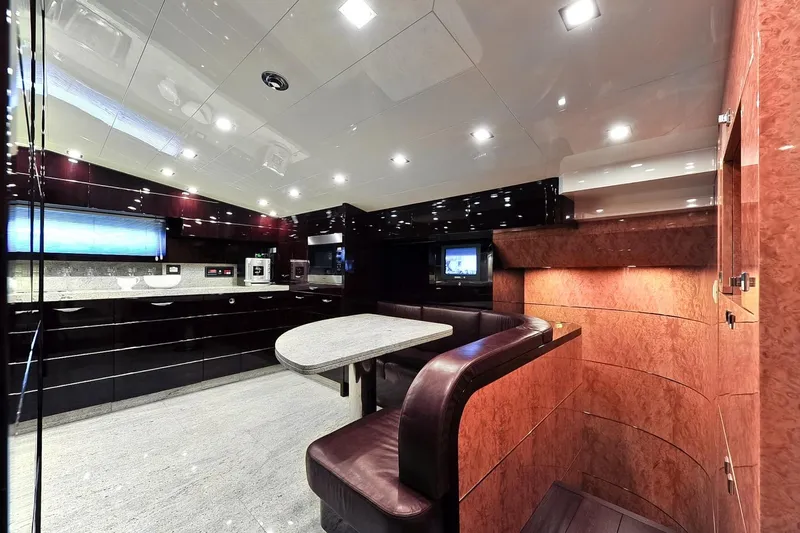  Yacht Photos Pics Luxurious interior of 2009 Maiora 32 yacht featuring modern kitchen and dining area.