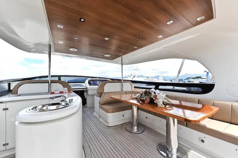  Yacht Photos Pics Luxurious 2009 Maiora 32 yacht interior with elegant seating and dining area.