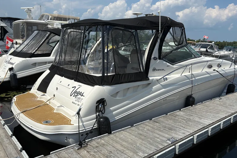  Yacht Photos Pics 2005 Sea Ray 340 Sundancer docked at marina under clear skies.