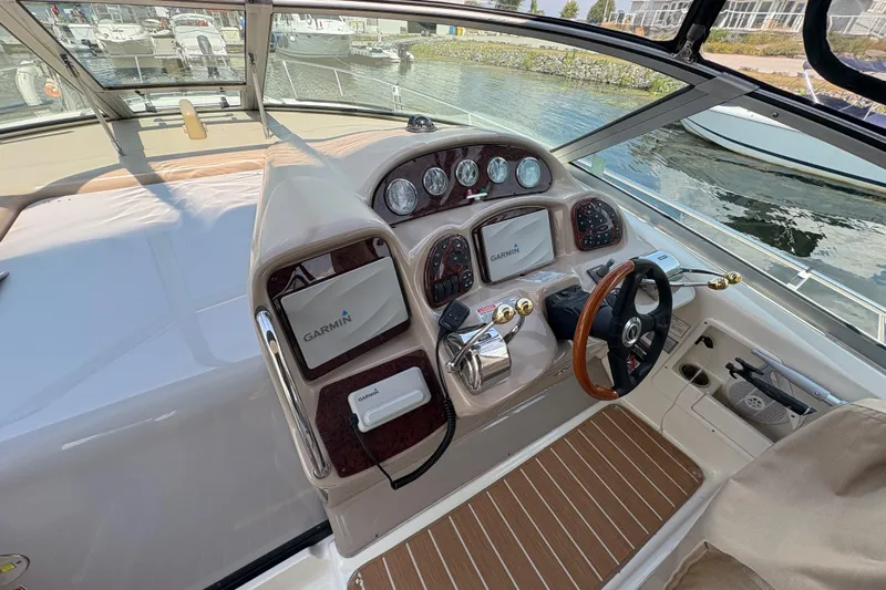  Yacht Photos Pics 2005 Sea Ray 340 Sundancer helm with Garmin navigation, docked at marina.