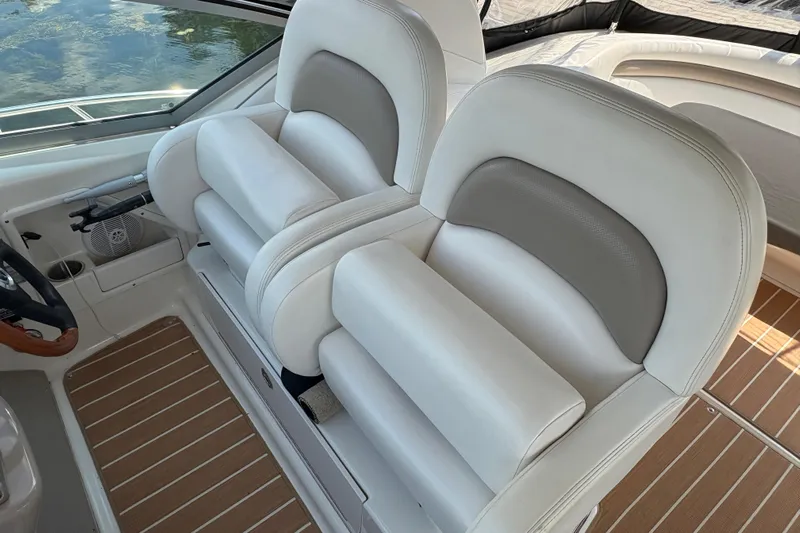  Yacht Photos Pics Luxury seating on 2005 Sea Ray 340 Sundancer boat, featuring white and gray upholstery.