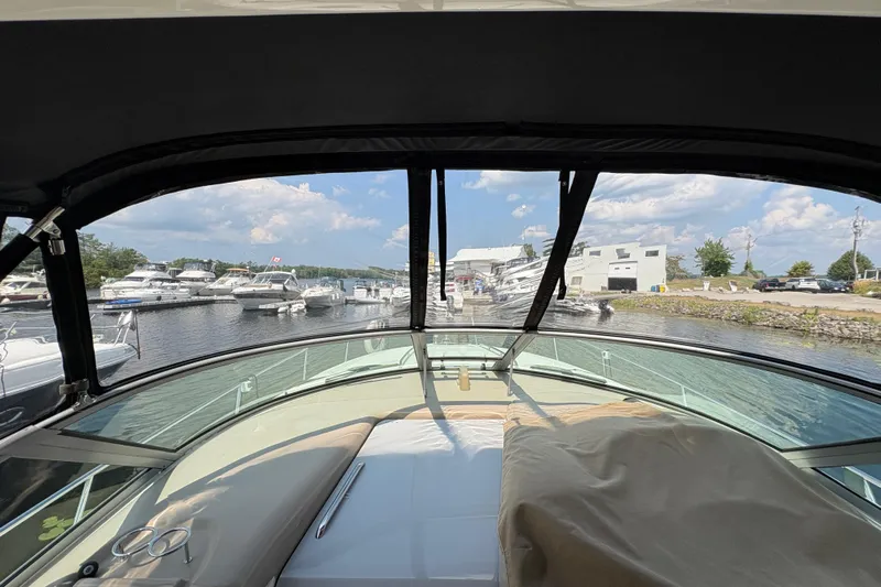  Yacht Photos Pics 2005 Sea Ray 340 Sundancer yacht docked at marina, sunny day, clear sky.